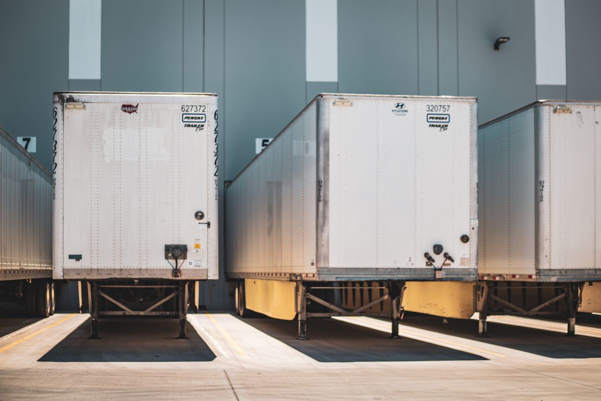 Loading dock doors with freight trailers backed into the bays
